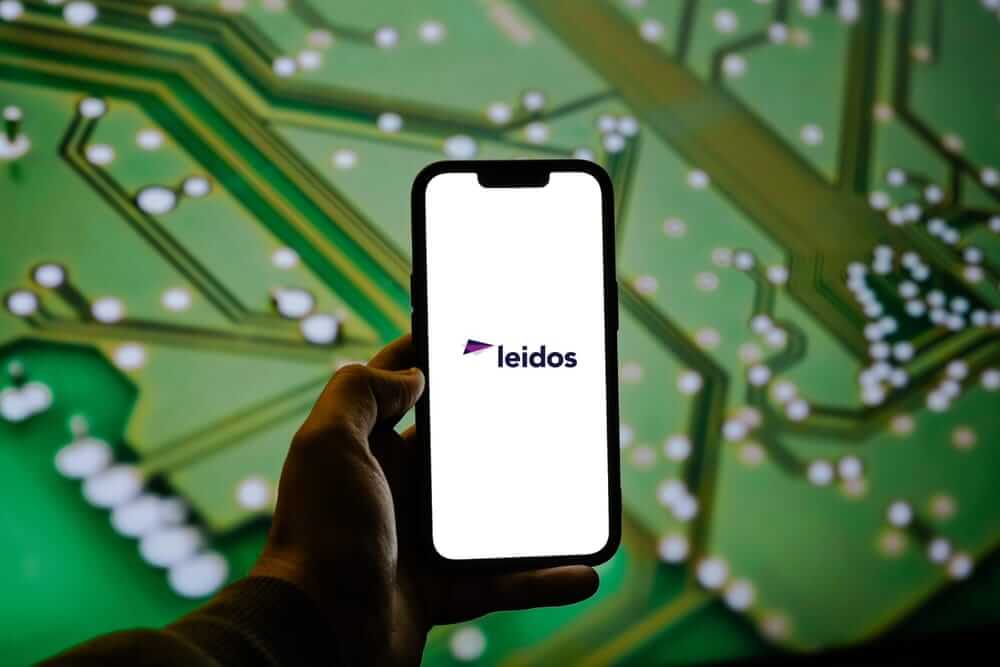 Leidos Holdings Inc logo on smartphone-by Photo For Everything via Shutterstock